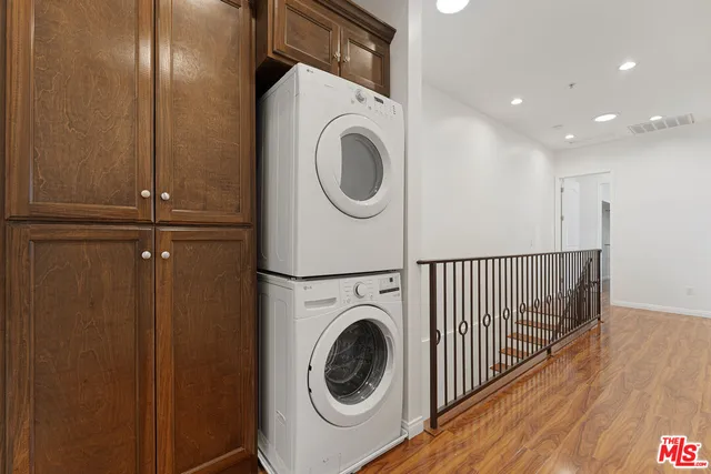 a view of hallway with wooden floor