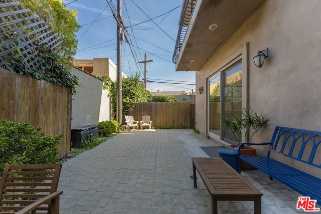a view of kitchen with microwave and refrigerator