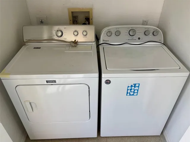 a close up view of washer and dryer with washer
