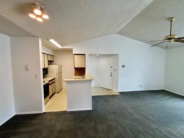 a view of kitchen with furniture and wooden floor