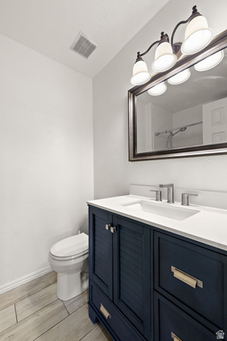 301 South 1200th Street East, Unit 31 St. George, UT 84790 - Photo 9 of 21 Full bathroom featuring vanity, wood finish floors, and a shower