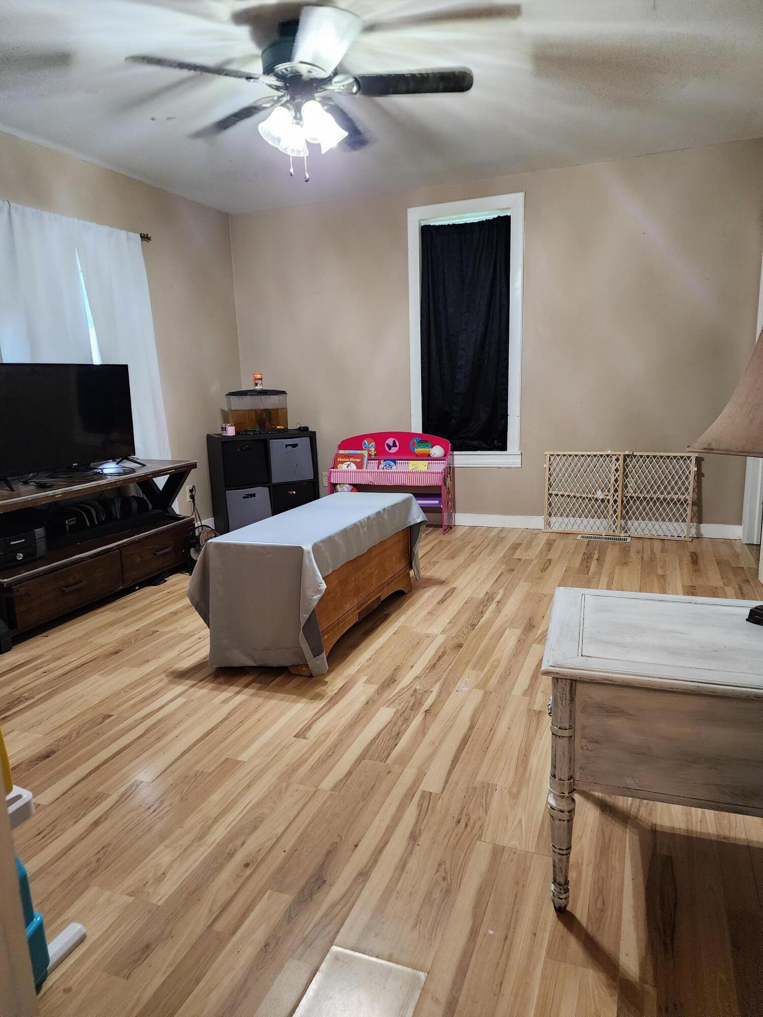 529 North Weston Street Rensselaer, IN 47978 - Photo 3 of 9 a living room with a couch and a flat screen tv