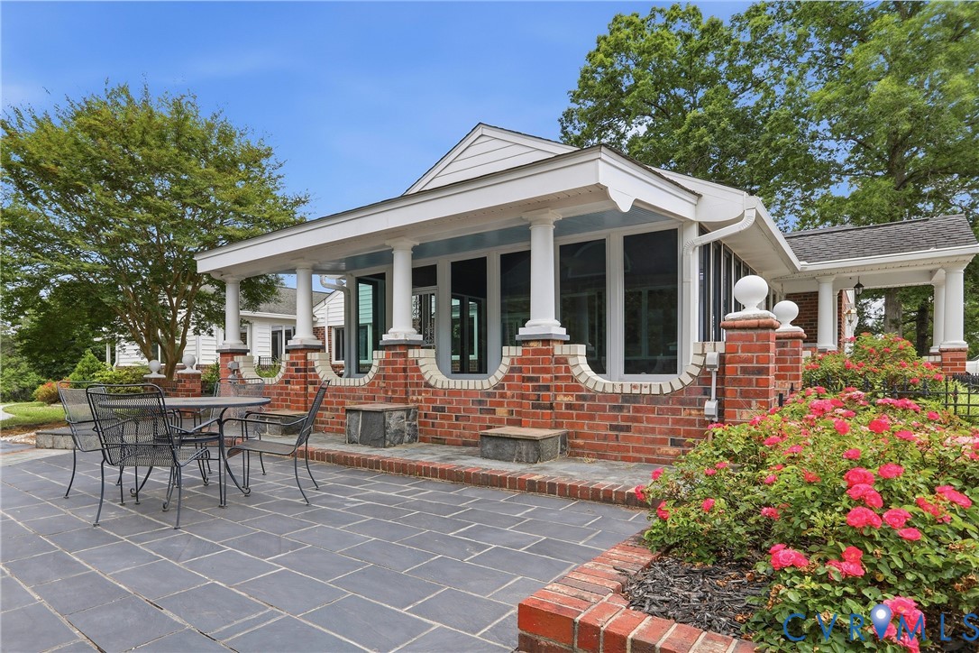 13300 West Patrick Henry Road Doswell, VA 23047 - Photo 47 of 69 Spacious paver patio with a brick-framed planting