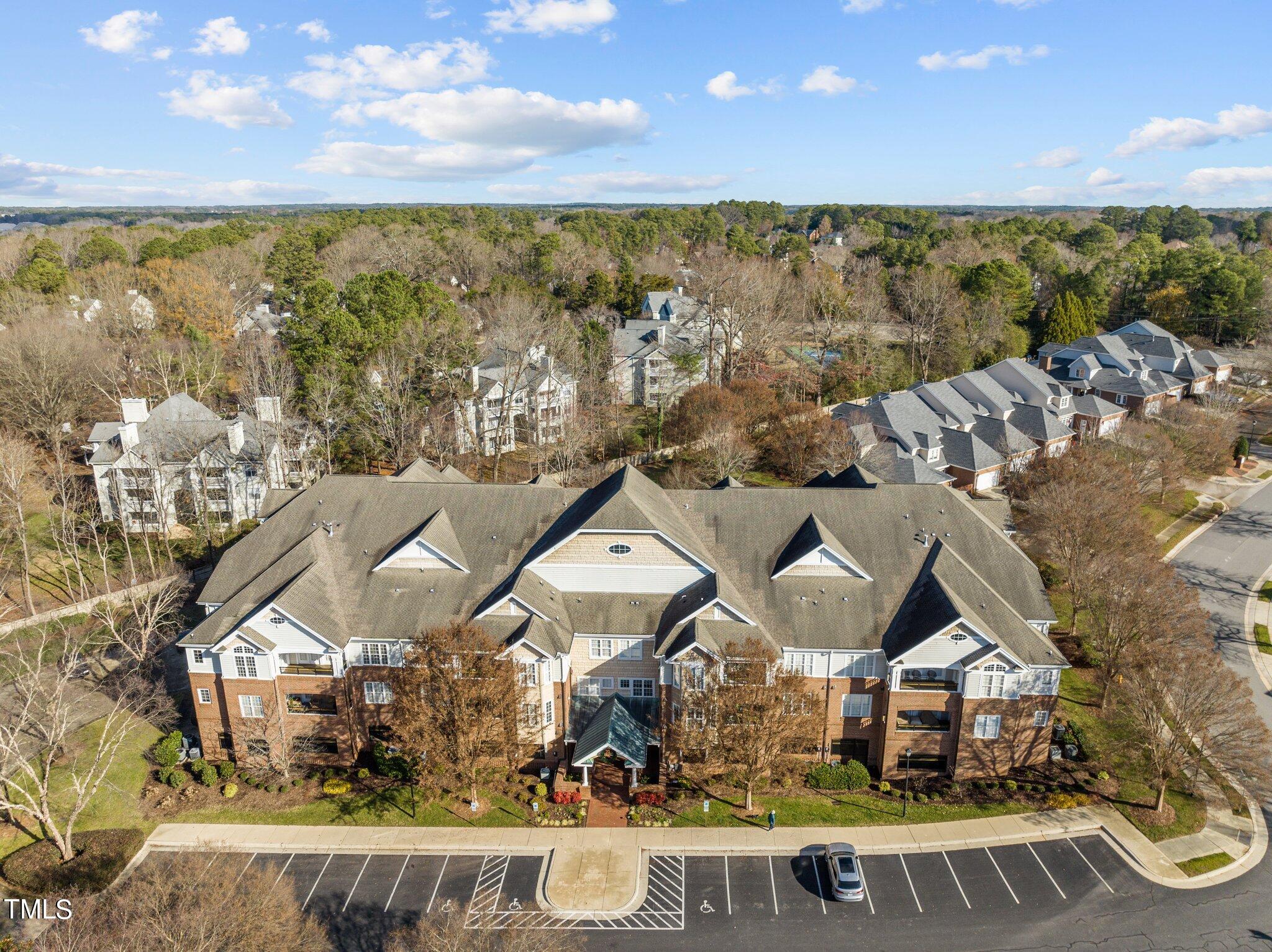 an aerial view of a house with a ocean view