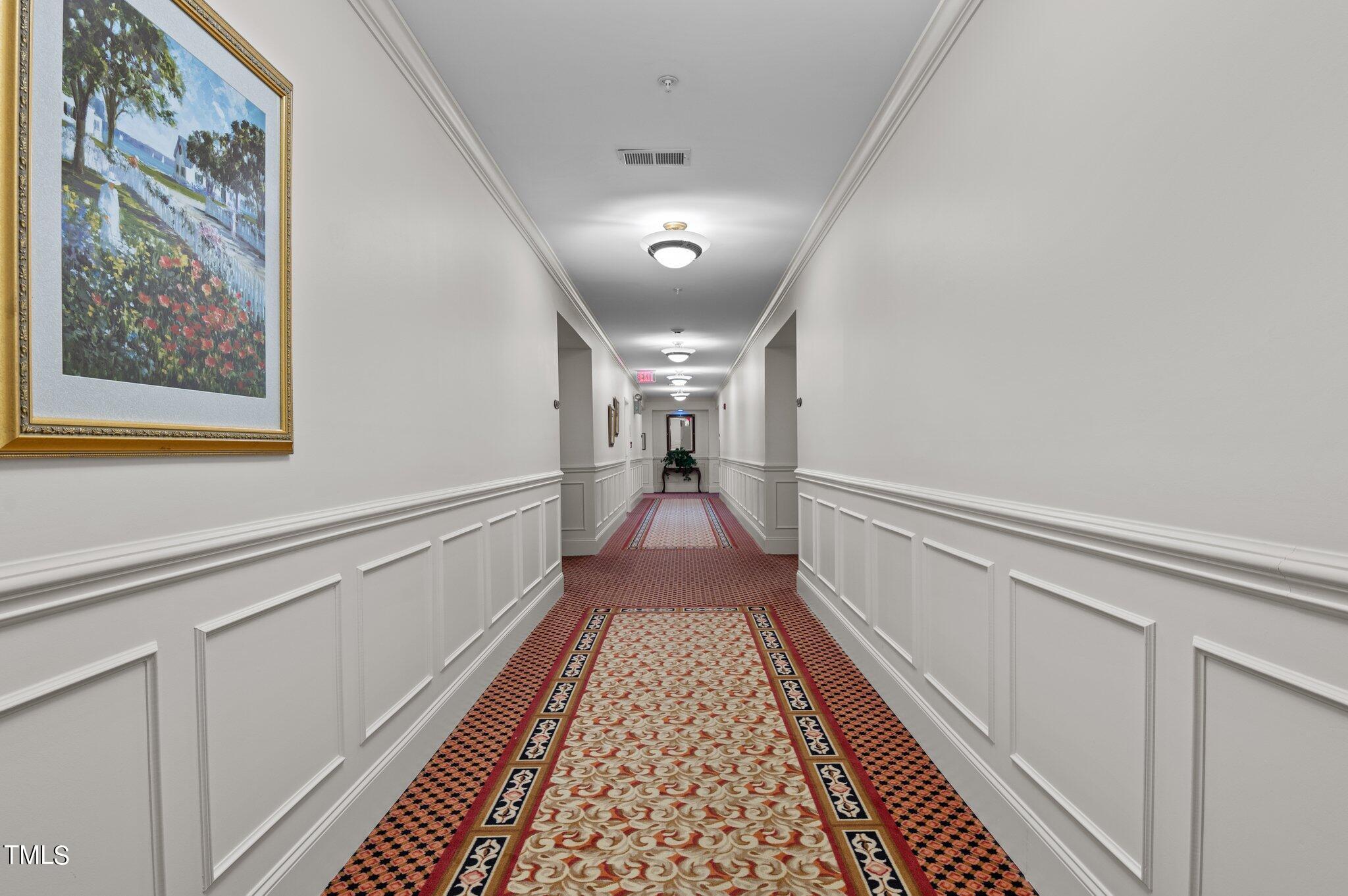 3700 Baron Cooper Pass, Unit 202 Raleigh, NC 27612 - Photo 12 of 49 a view of a hallway with wooden floor