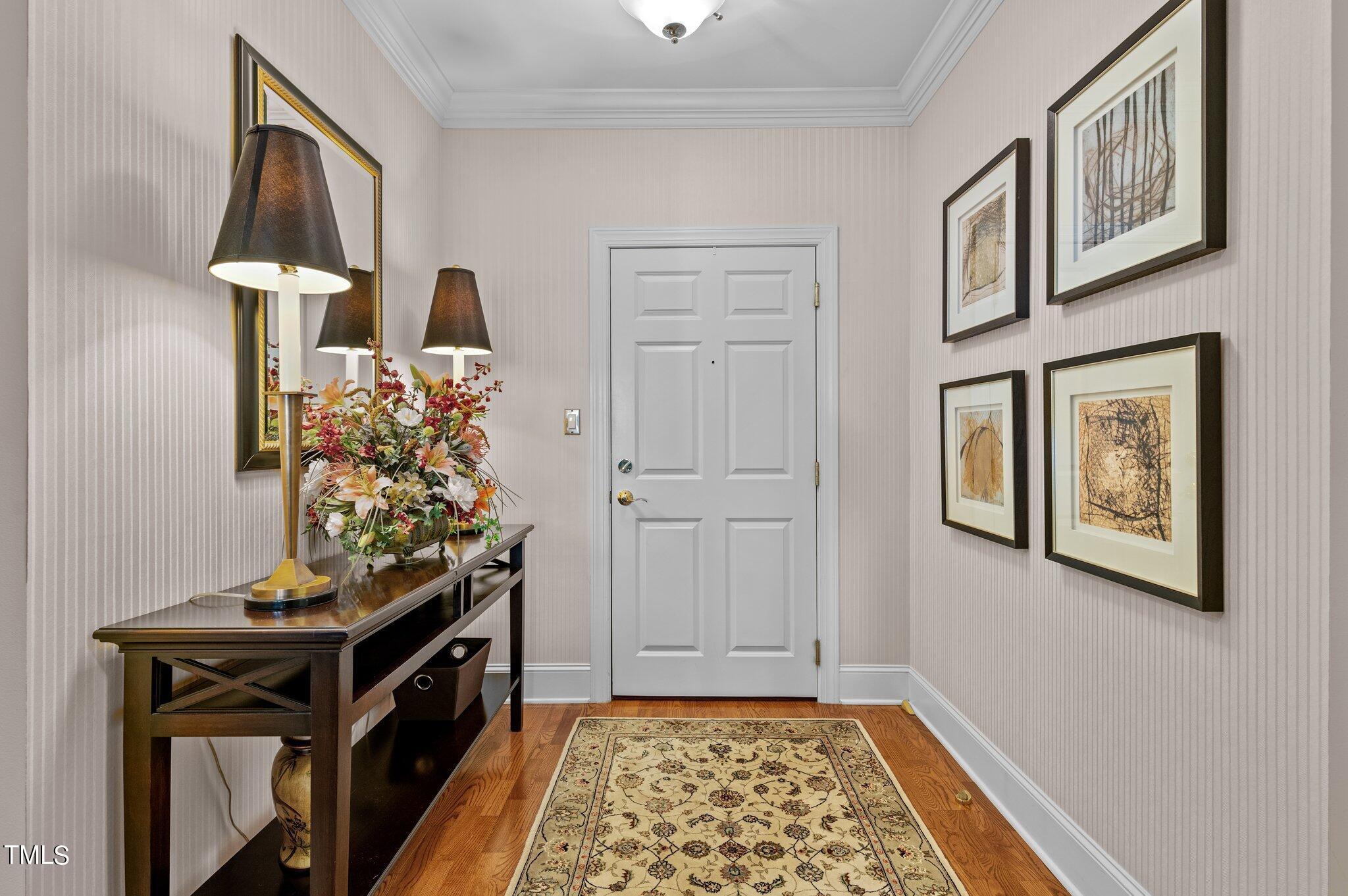 3700 Baron Cooper Pass, Unit 202 Raleigh, NC 27612 - Photo 13 of 49 a living room with furniture and a rug