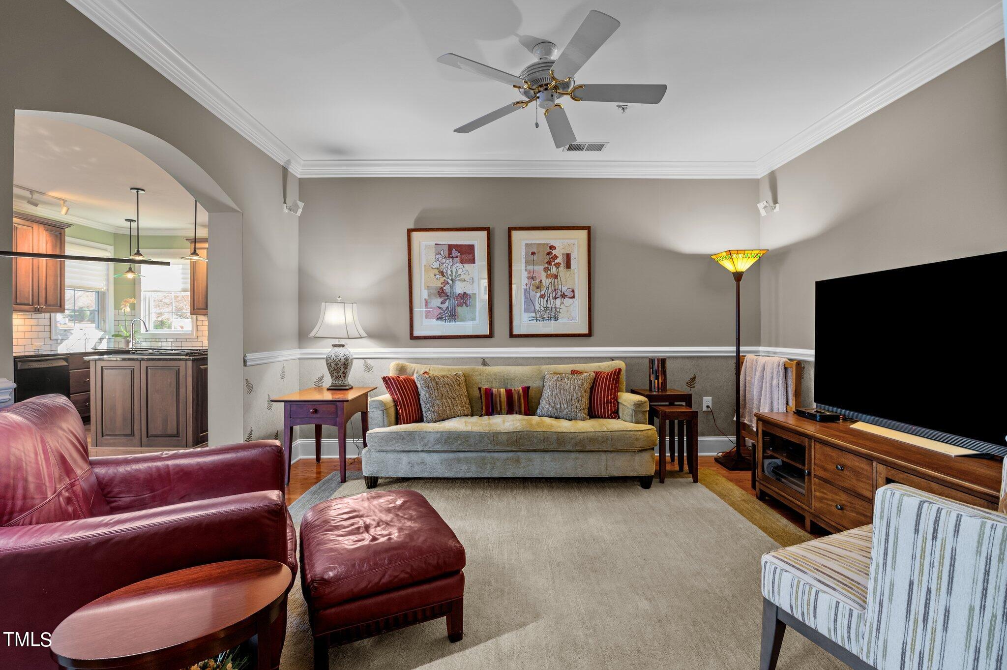3700 Baron Cooper Pass, Unit 202 Raleigh, NC 27612 - Photo 18 of 49 a living room with furniture and a flat screen tv