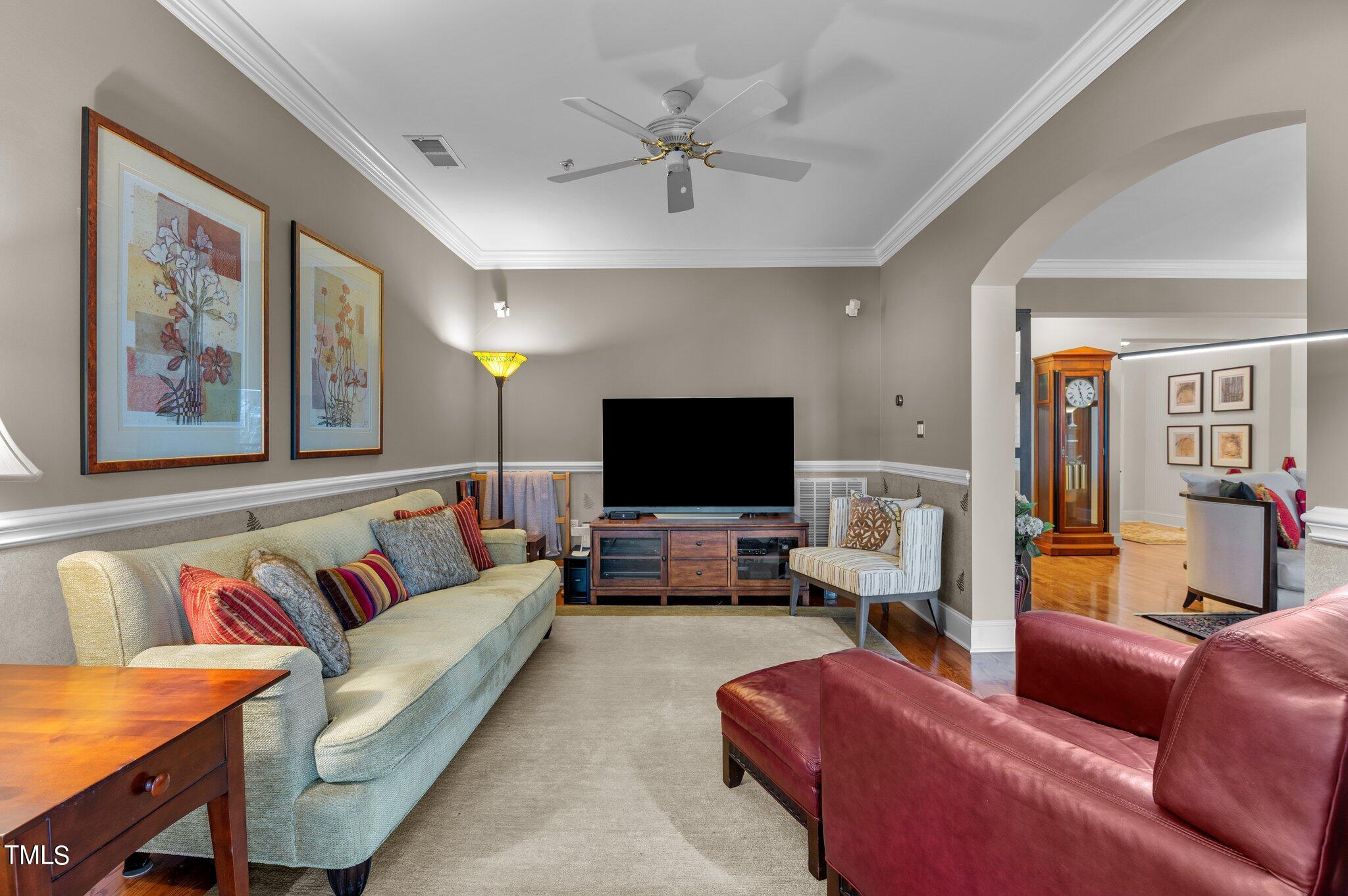 3700 Baron Cooper Pass, Unit 202 Raleigh, NC 27612 - Photo 19 of 49 a living room with furniture and a flat screen tv
