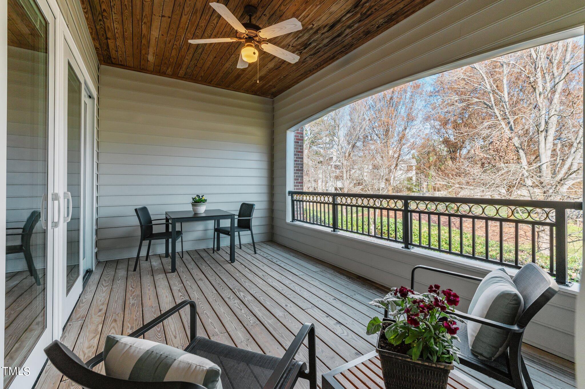 3700 Baron Cooper Pass, Unit 202 Raleigh, NC 27612 - Photo 27 of 49 a balcony with furniture and potted plants