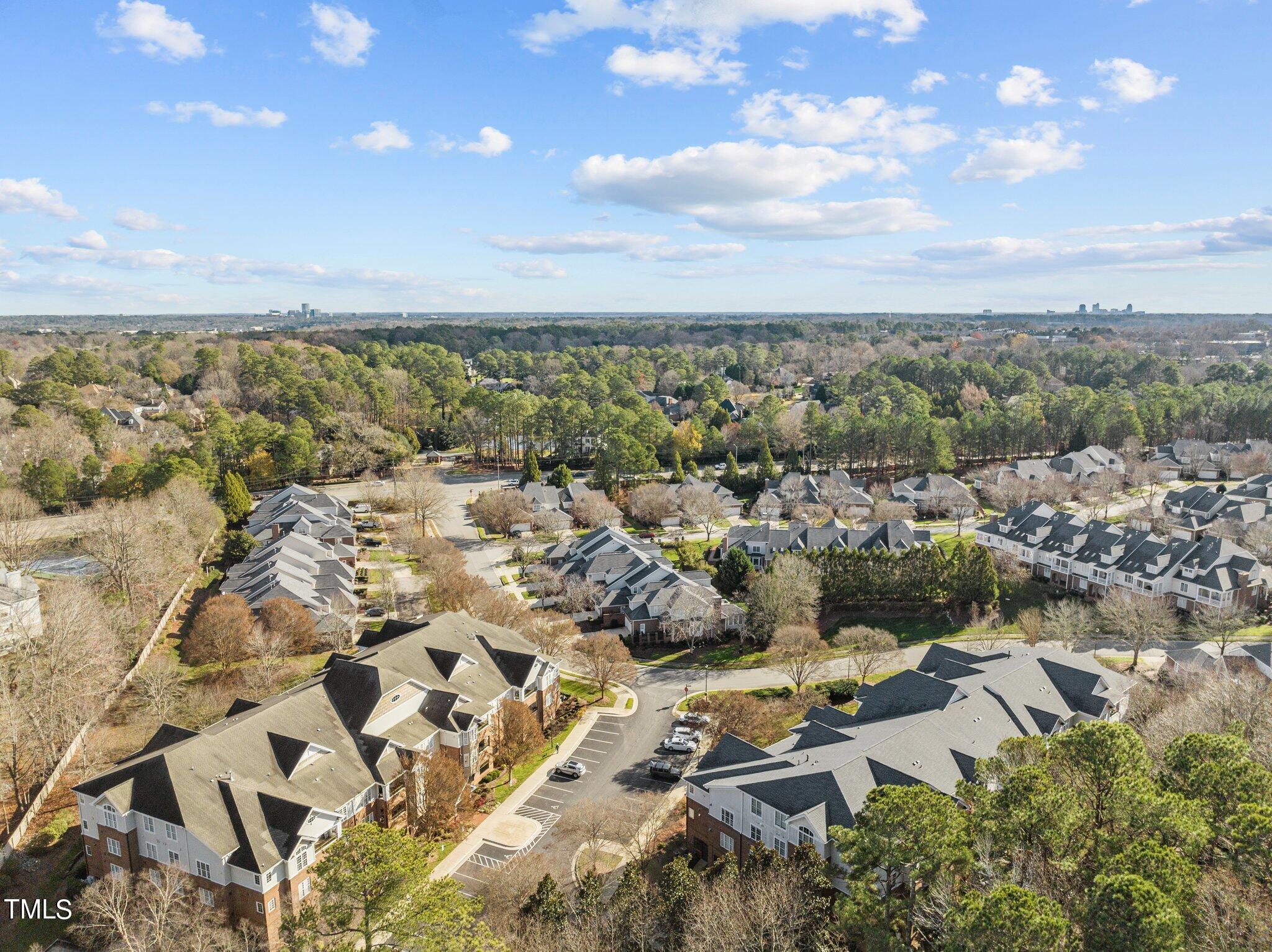 3700 Baron Cooper Pass, Unit 202 Raleigh, NC 27612 - Photo 3 of 49 an aerial view of residential building with outdoor space
