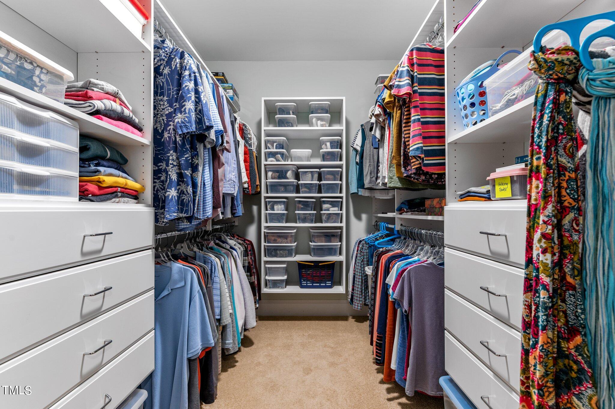 3700 Baron Cooper Pass, Unit 202 Raleigh, NC 27612 - Photo 31 of 49 a view of walk in closet with clothes and shoes