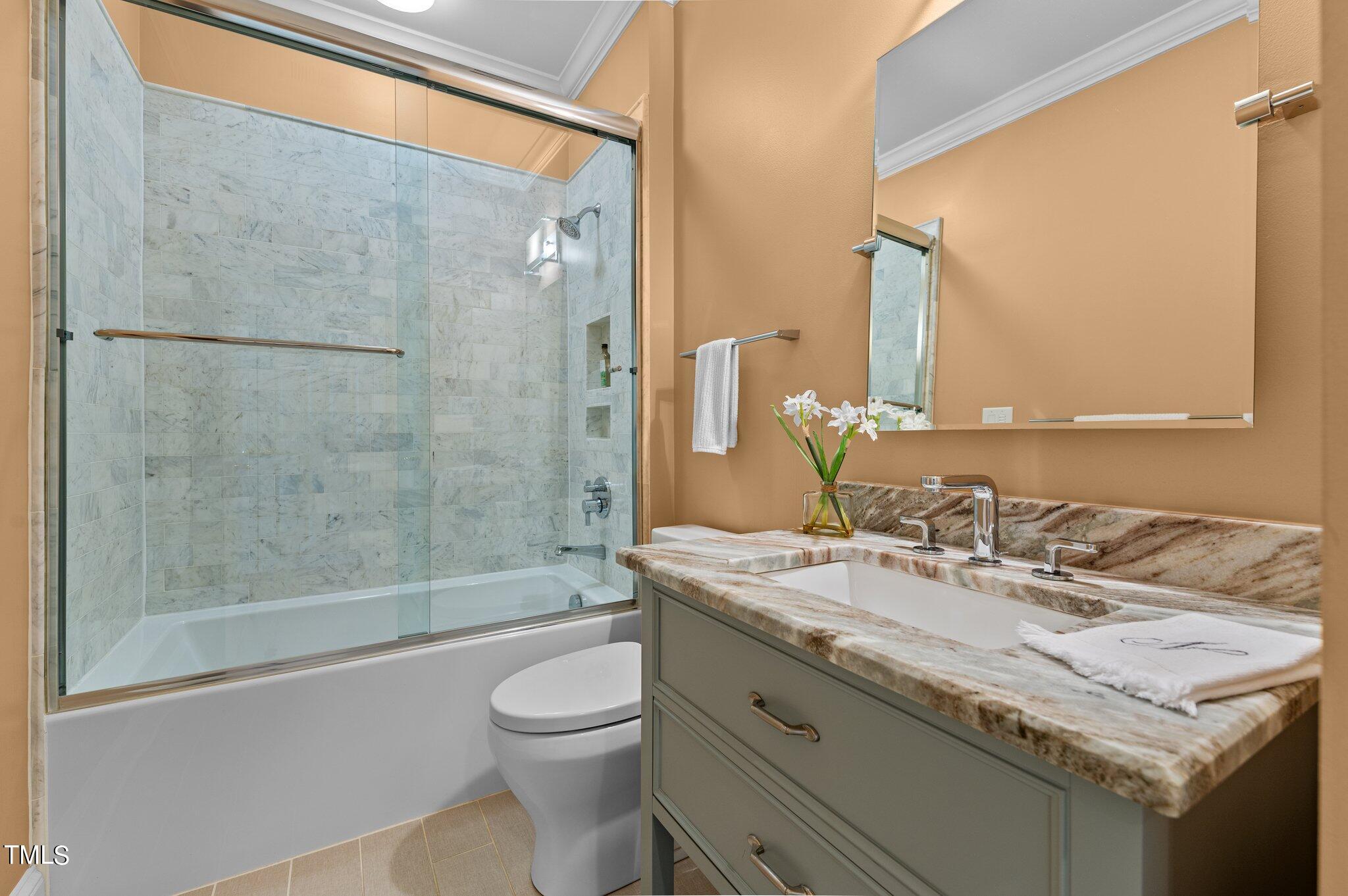 3700 Baron Cooper Pass, Unit 202 Raleigh, NC 27612 - Photo 36 of 49 a bathroom with a granite countertop sink toilet and shower