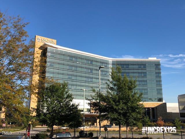 3700 Baron Cooper Pass, Unit 202 Raleigh, NC 27612 - Photo 45 of 49 a front view of a building with trees