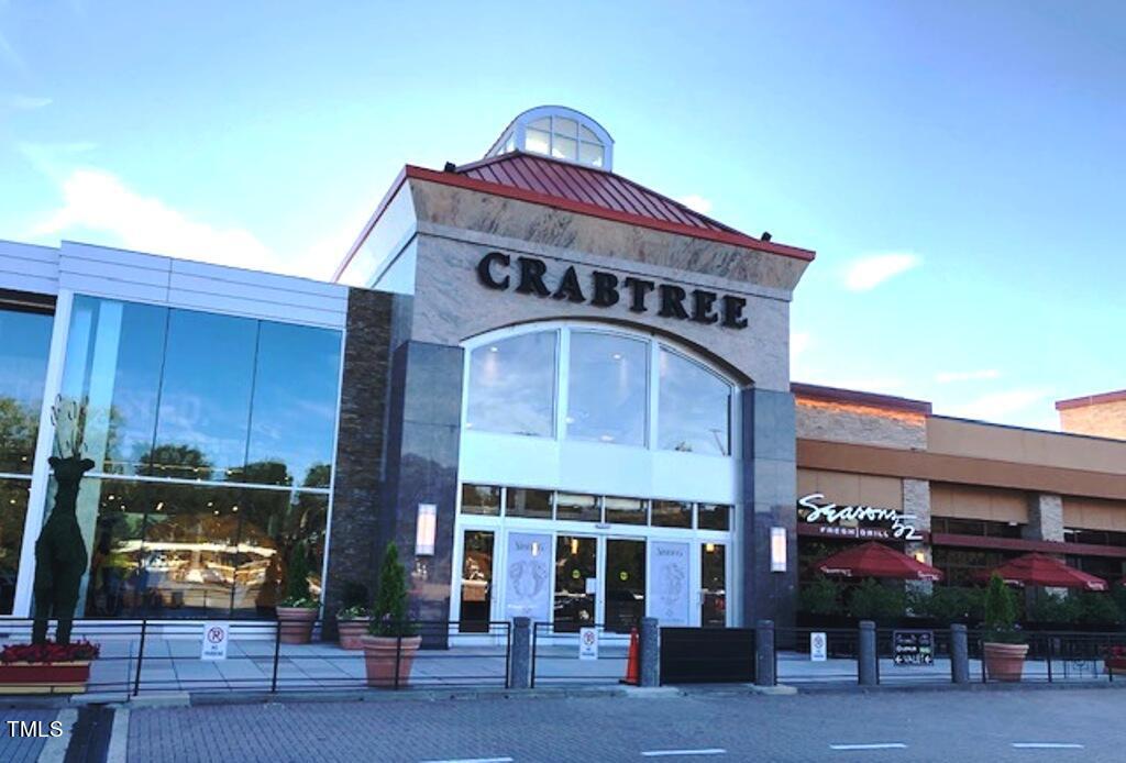 3700 Baron Cooper Pass, Unit 202 Raleigh, NC 27612 - Photo 47 of 49 a front view of a building with street