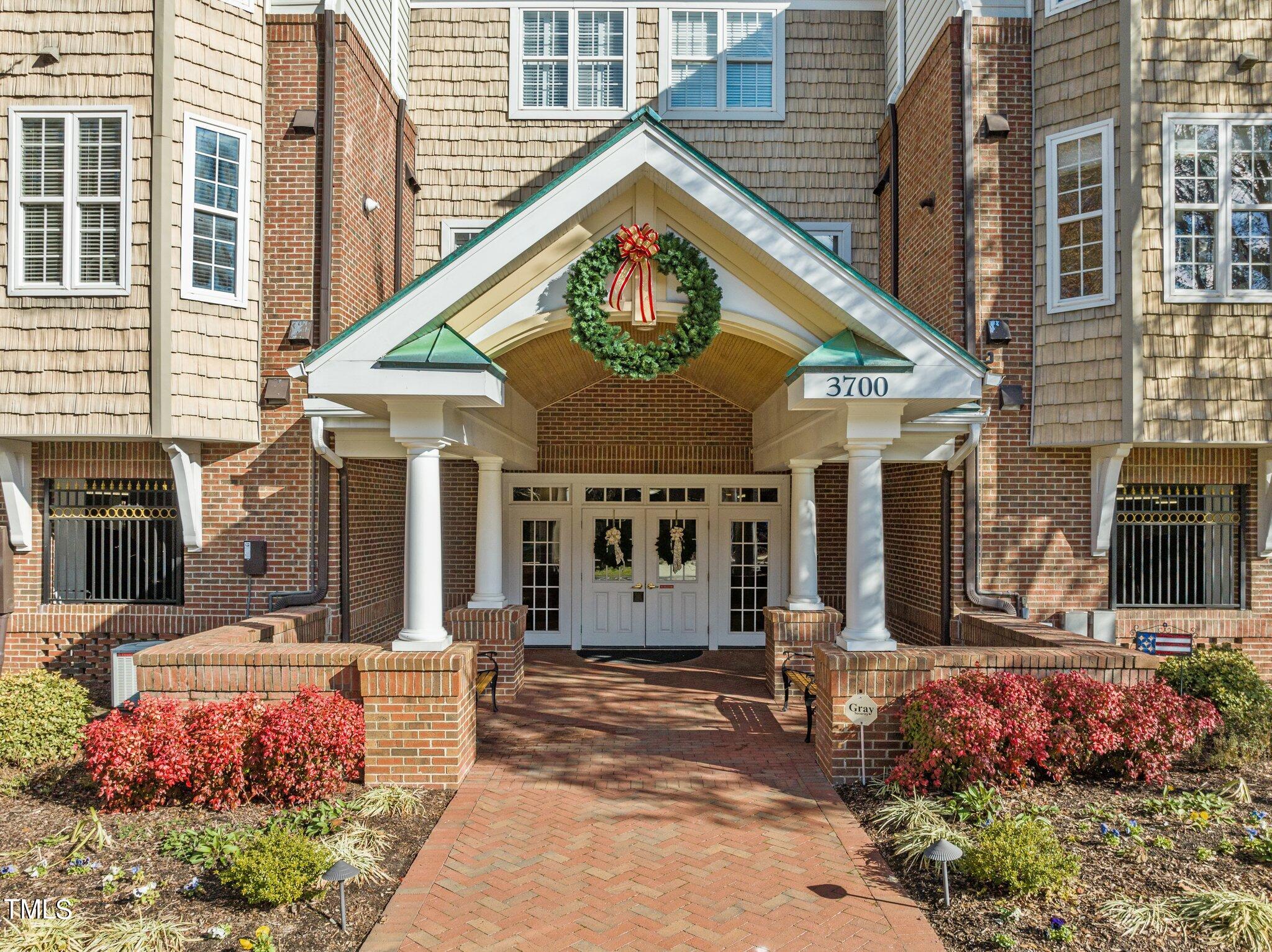 3700 Baron Cooper Pass, Unit 202 Raleigh, NC 27612 - Photo 5 of 49 a front view of a building with an outdoor space