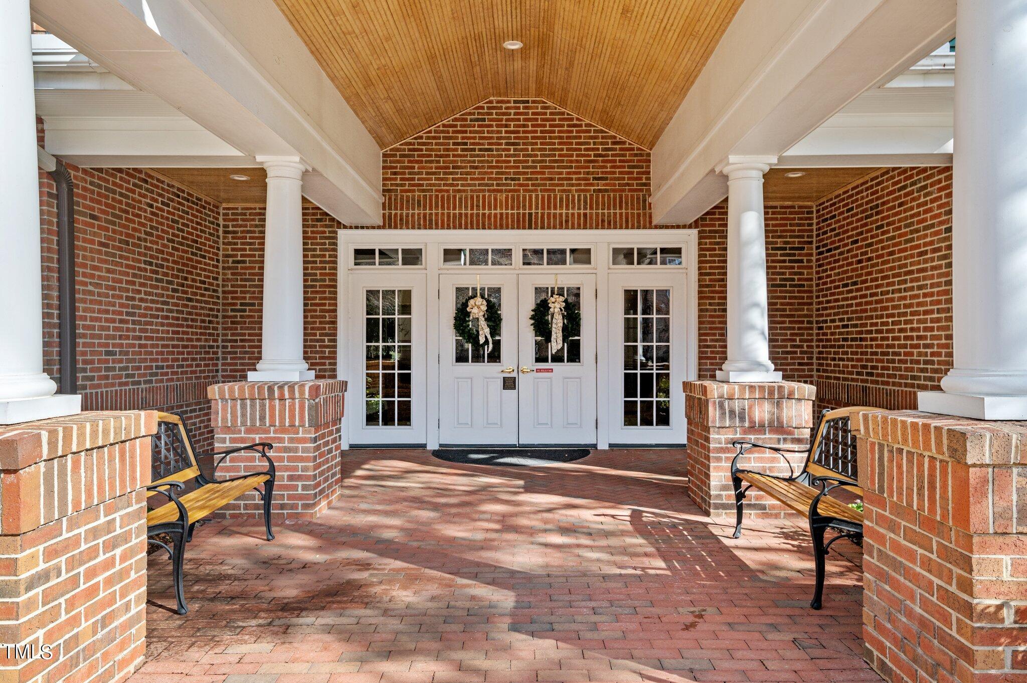 3700 Baron Cooper Pass, Unit 202 Raleigh, NC 27612 - Photo 6 of 49 a front view of a house with barbeque oven and seating space