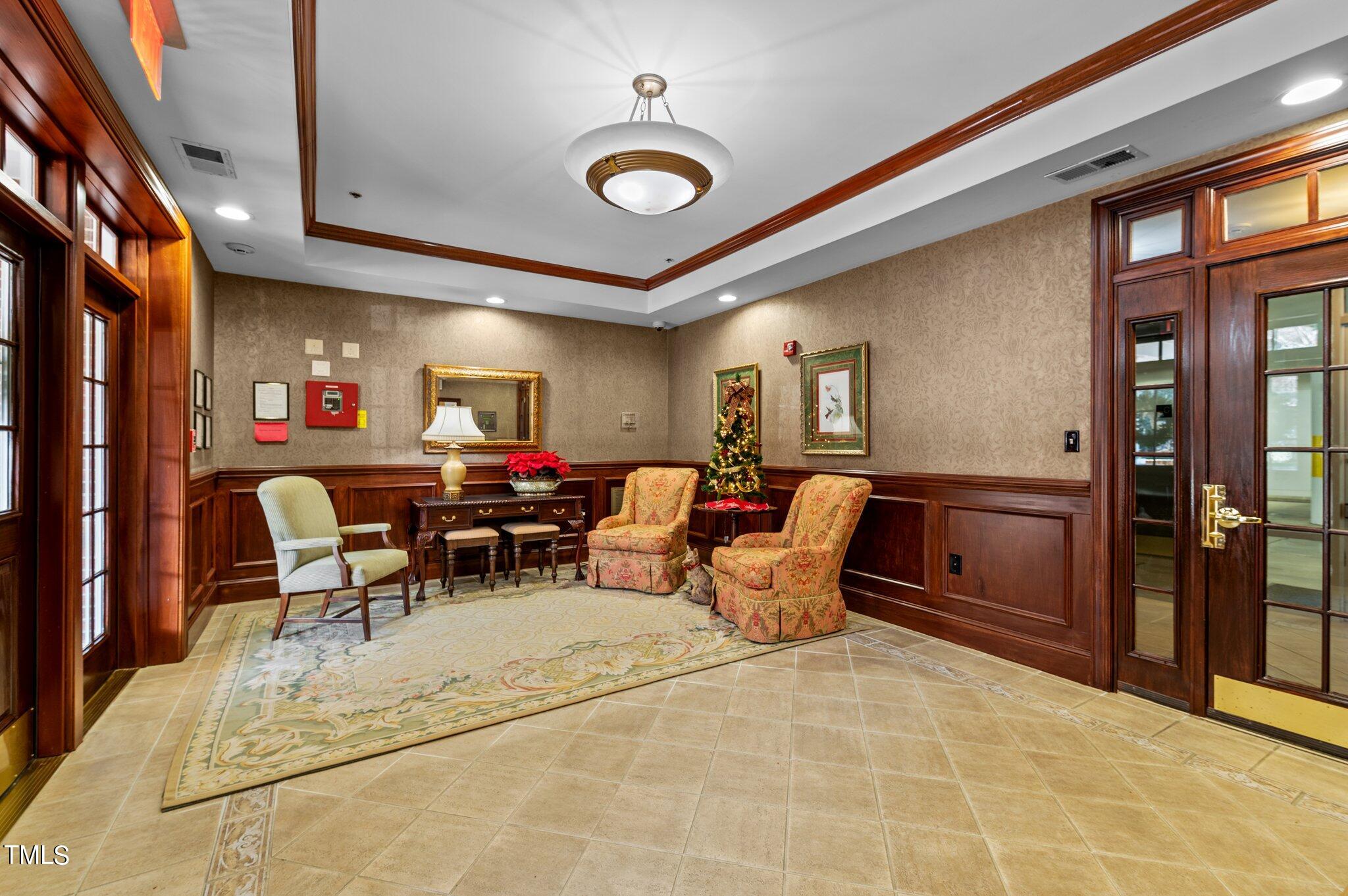 3700 Baron Cooper Pass, Unit 202 Raleigh, NC 27612 - Photo 8 of 49 a living room with furniture a dining table and chairs