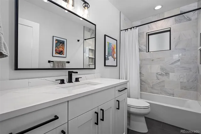 a view of a livingroom with workspace and a couch