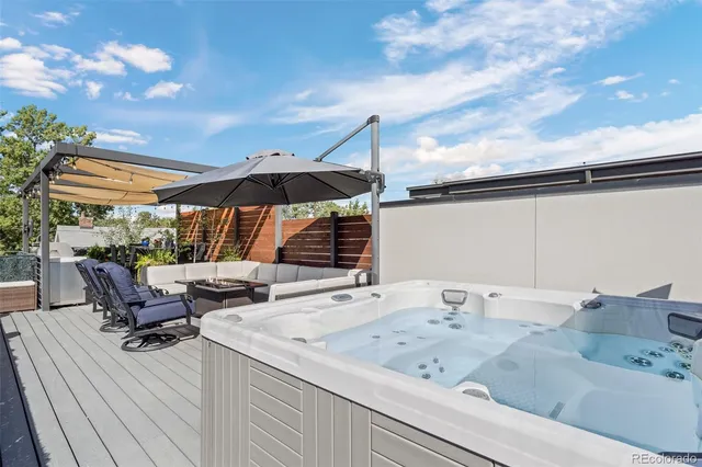 a room with table chairs and a potted plant