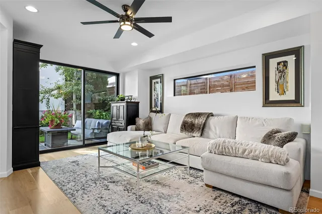 a living room with furniture and a rug