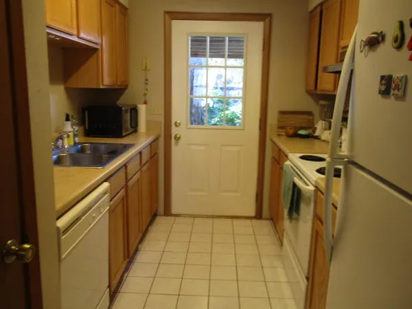 a view of a kitchen with storage and utility