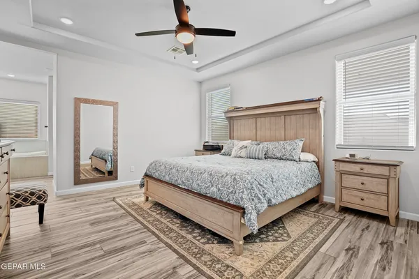 a bedroom with a bed and a dresser