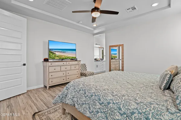 a bedroom with a bed and a dresser