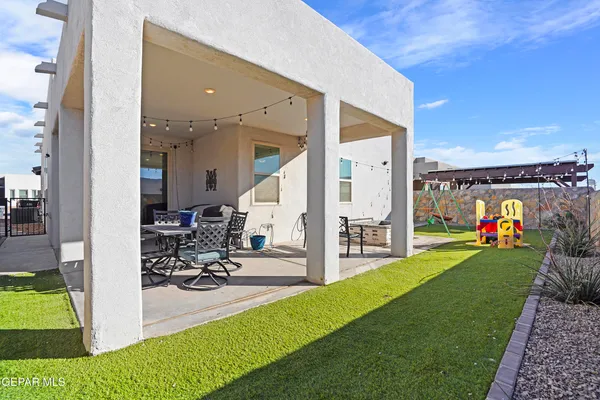 an aerial view of houses with outdoor space