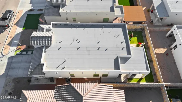 an aerial view of a house with a garden