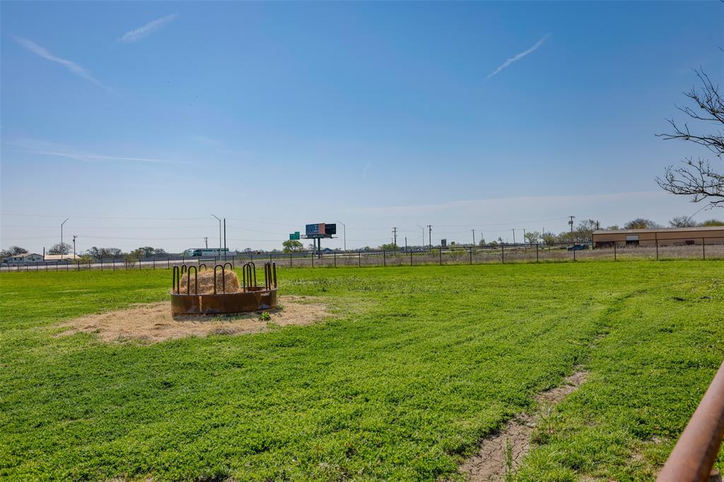 3511 Interstate 35 Gainesville, TX 76240 - Photo 21 of 40 a view of a swimming pool and a yard