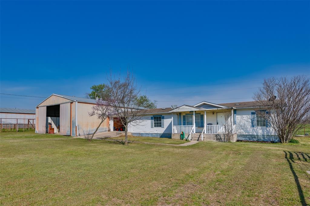 3511 Interstate 35 Gainesville, TX 76240 - Photo 23 of 40 a front view of a house with a yard