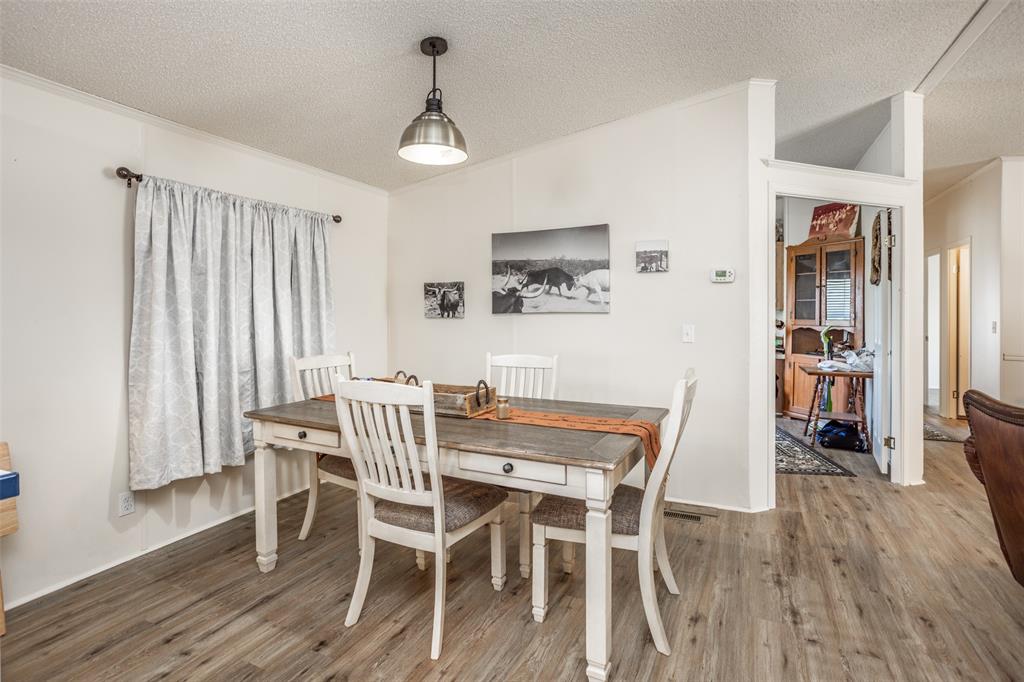3511 Interstate 35 Gainesville, TX 76240 - Photo 29 of 40 a view of a dining room with furniture and wooden floor