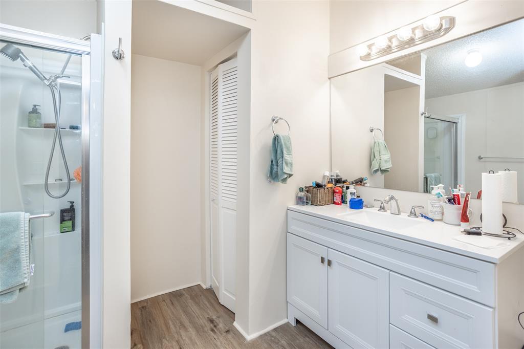 3511 Interstate 35 Gainesville, TX 76240 - Photo 31 of 40 a bathroom with a double vanity sink mirror and shower