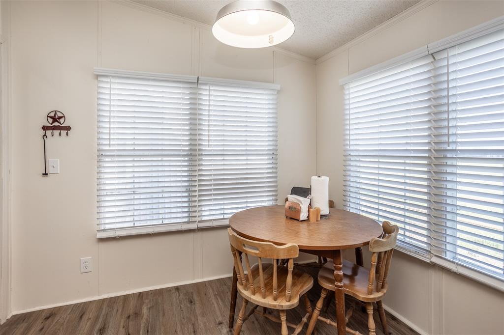 3511 Interstate 35 Gainesville, TX 76240 - Photo 32 of 40 a view of a dining room with furniture and wooden floor