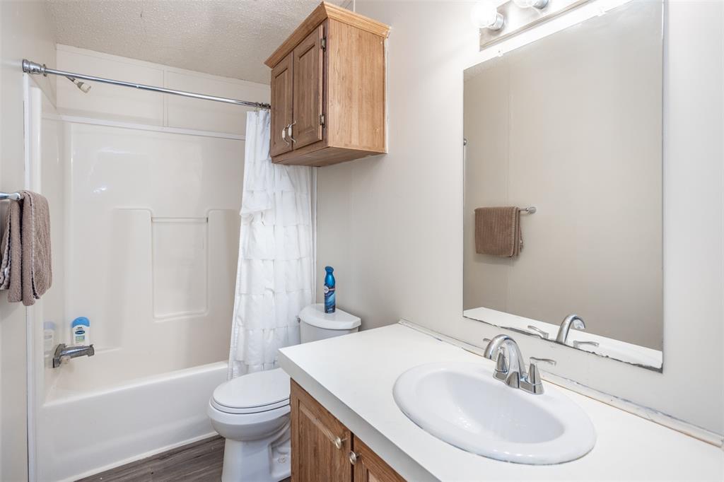 3511 Interstate 35 Gainesville, TX 76240 - Photo 35 of 40 a bathroom with a sink toilet and shower