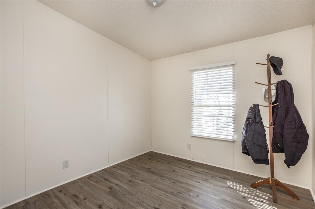 3511 Interstate 35 Gainesville, TX 76240 - Photo 37 of 40 a view of empty room with wooden floor and fan