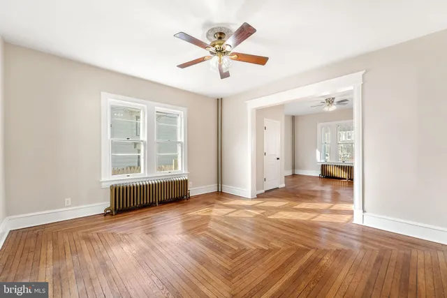 a view of livingroom with hardwood floor and ceiling fan