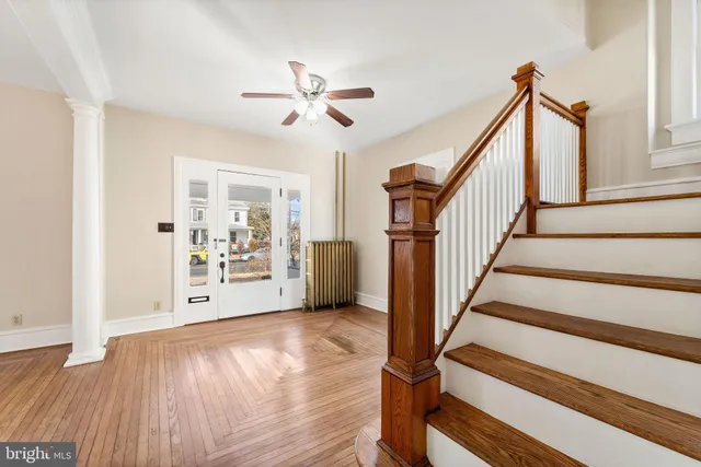 a view of an entryway with wooden floor
