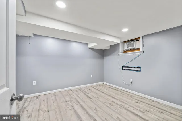 a view of a room with wooden floor