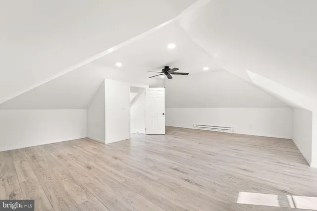 a view of an empty room with white walls