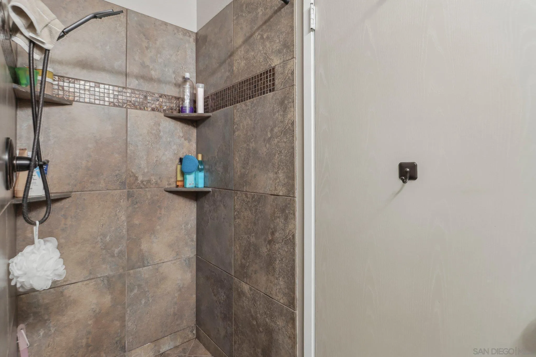 9186 Truman Street San Diego, CA 92129 - Photo 18 of 61 a bathroom with a shower