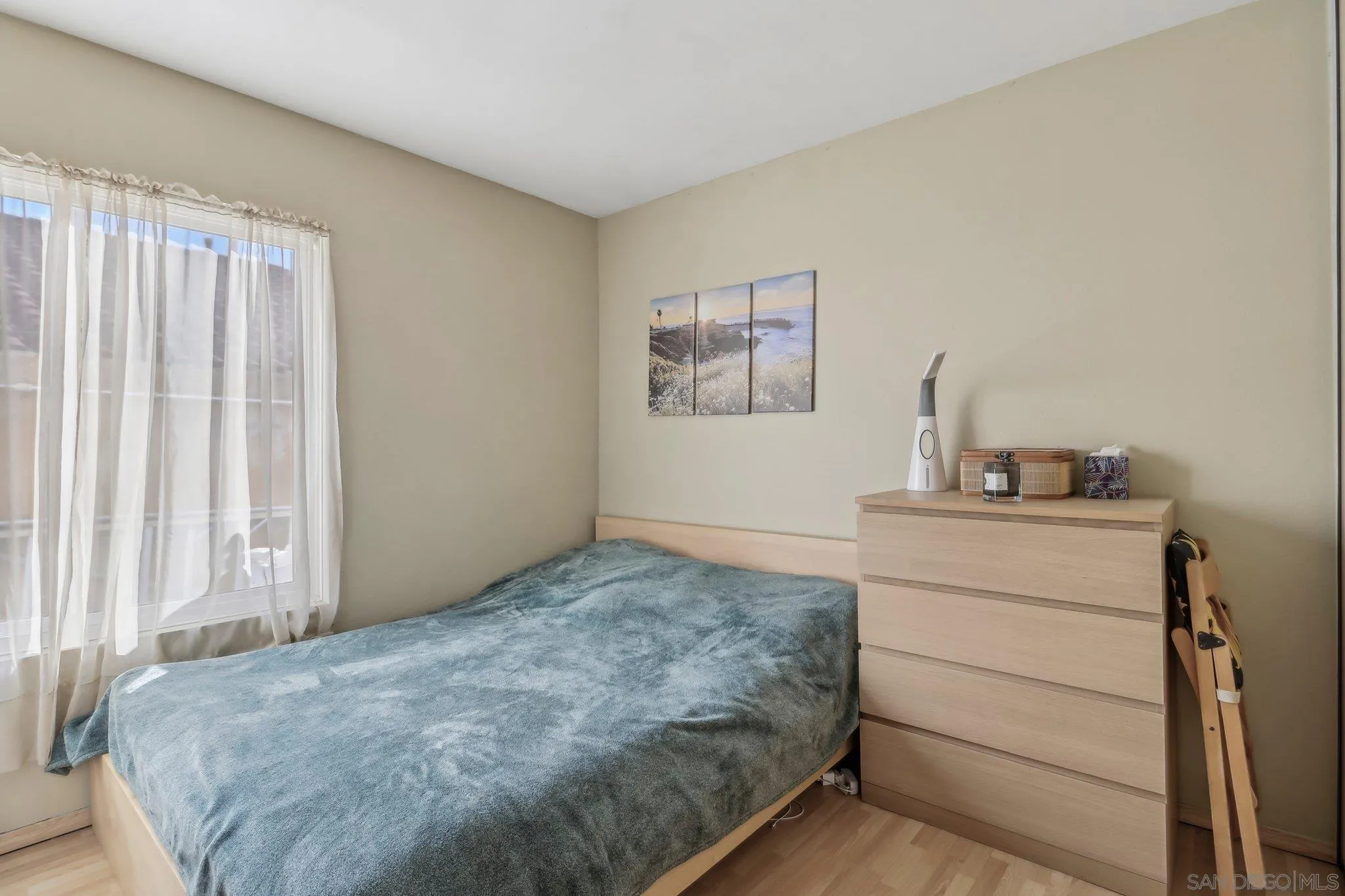 9186 Truman Street San Diego, CA 92129 - Photo 19 of 61 a bedroom with a bed and a window