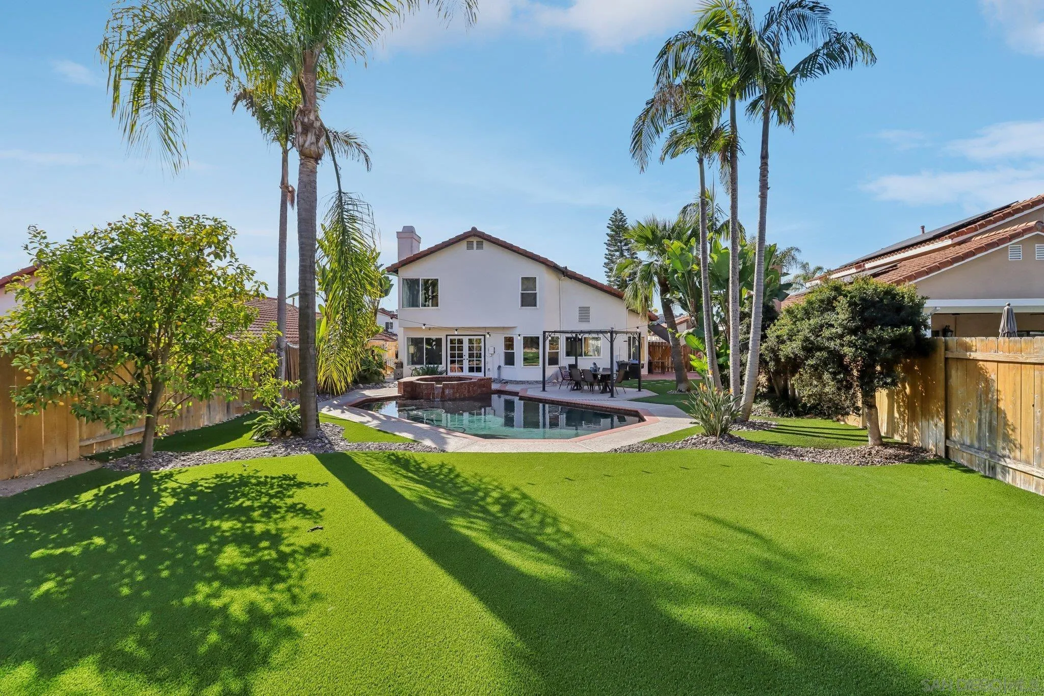 9186 Truman Street San Diego, CA 92129 - Photo 28 of 61 a view of a house with swimming pool and a yard
