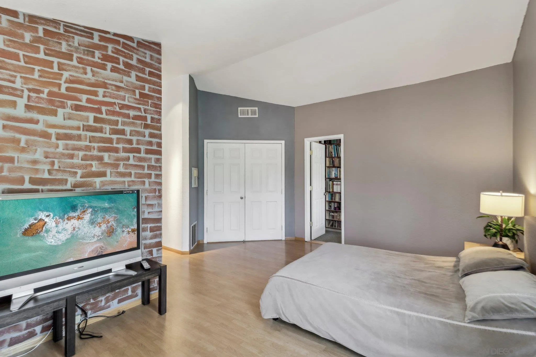 9186 Truman Street San Diego, CA 92129 - Photo 31 of 61 a bedroom with a bed and a flat screen tv