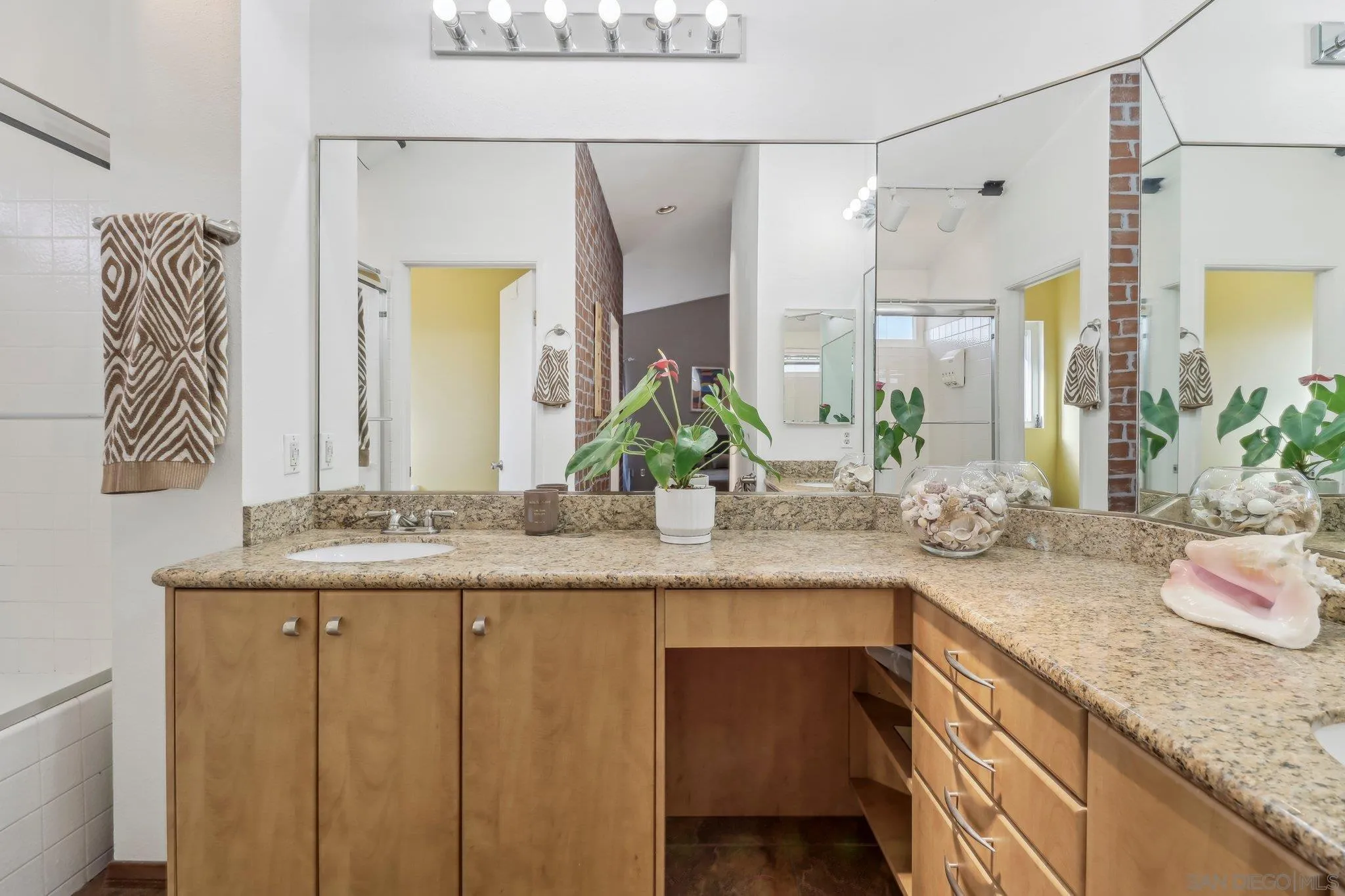 9186 Truman Street San Diego, CA 92129 - Photo 32 of 61 a bathroom with a granite countertop sink and a mirror