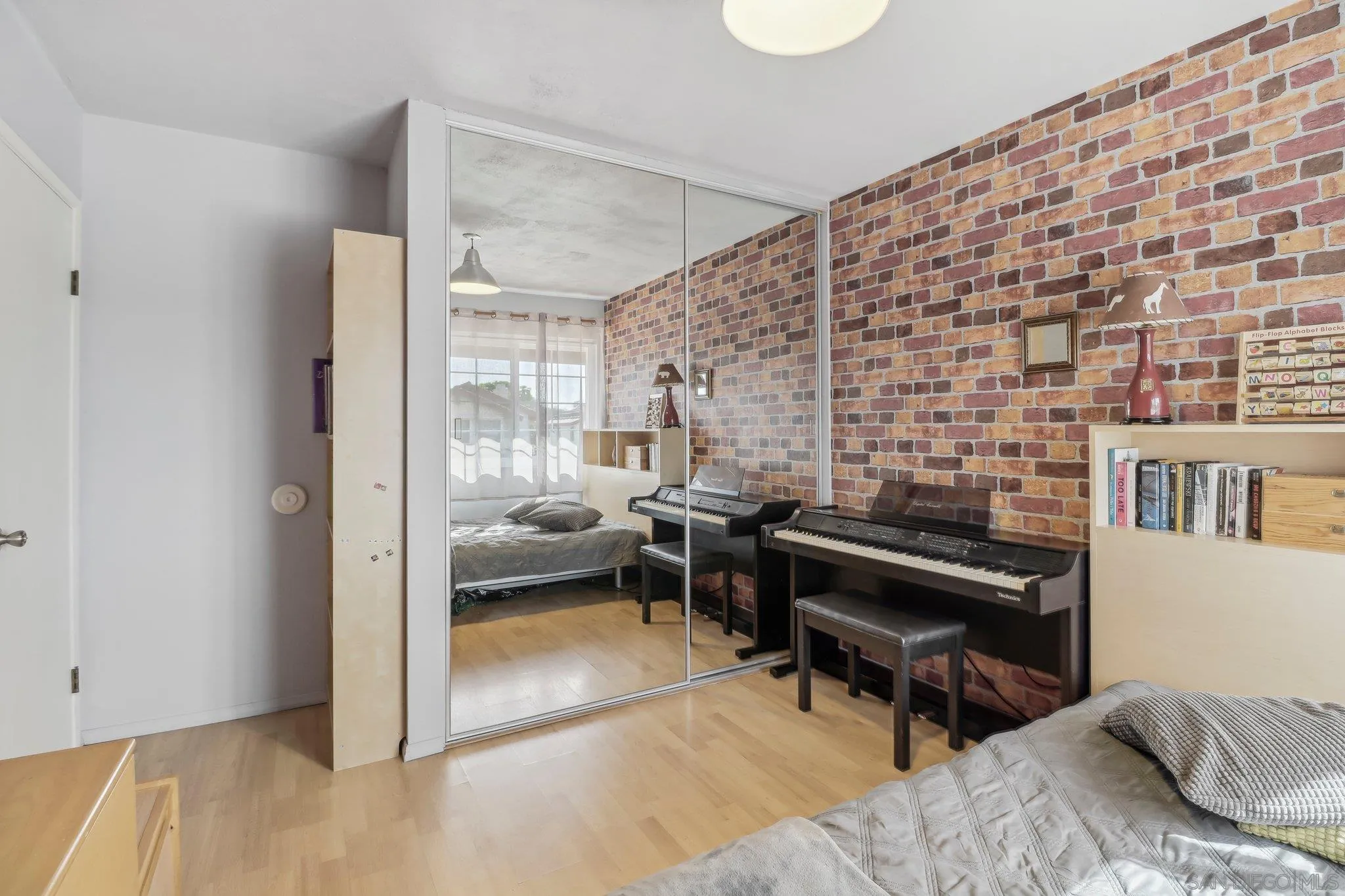 9186 Truman Street San Diego, CA 92129 - Photo 36 of 61 a bedroom with furniture and a window