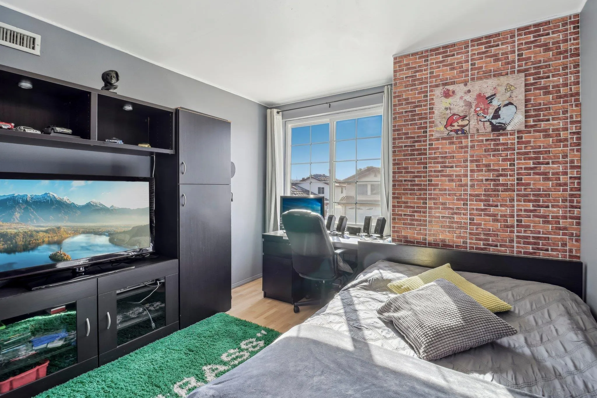 9186 Truman Street San Diego, CA 92129 - Photo 38 of 61 a bedroom with a bed and a flat screen tv