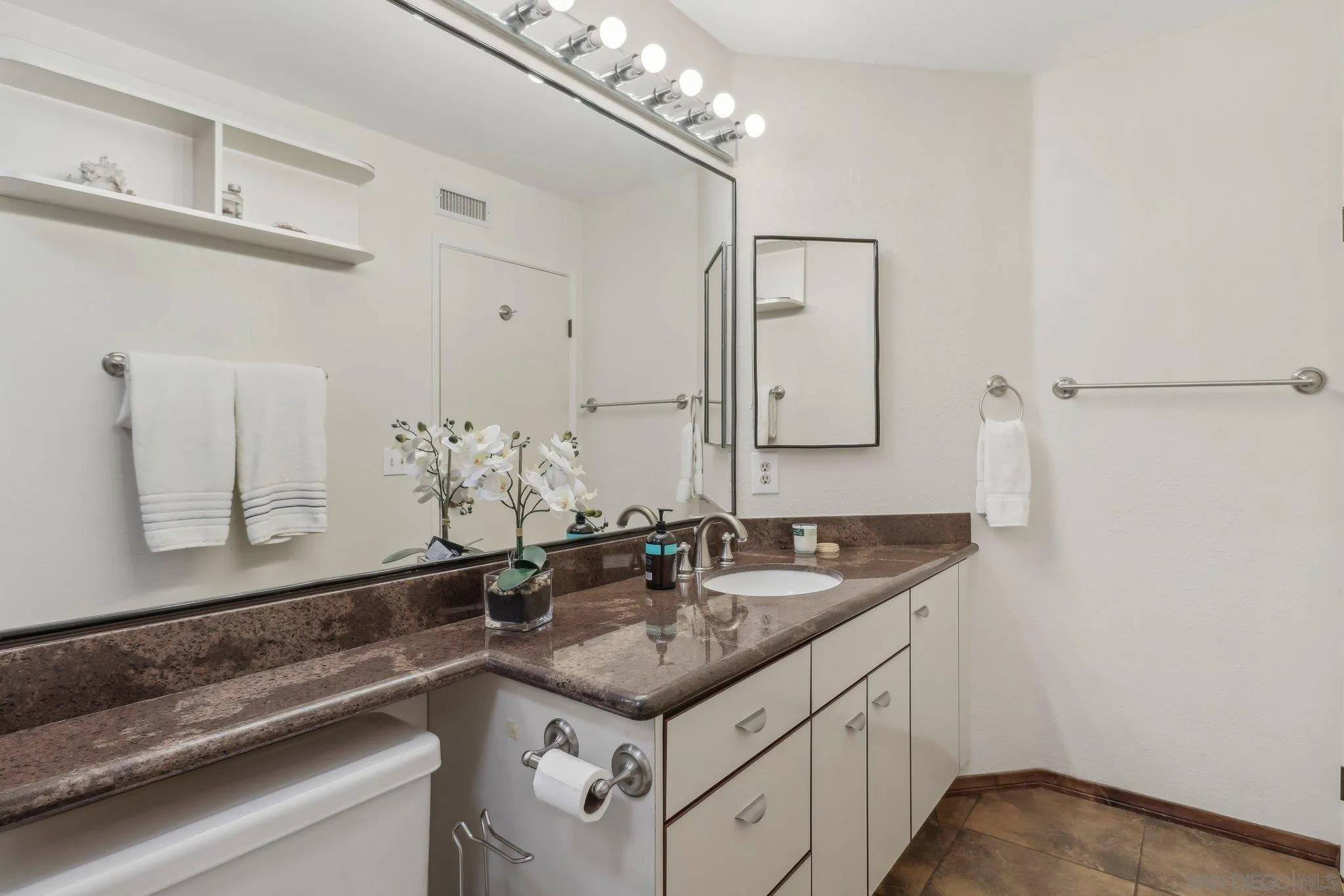 9186 Truman Street San Diego, CA 92129 - Photo 40 of 61 a bathroom with a sink and a mirror
