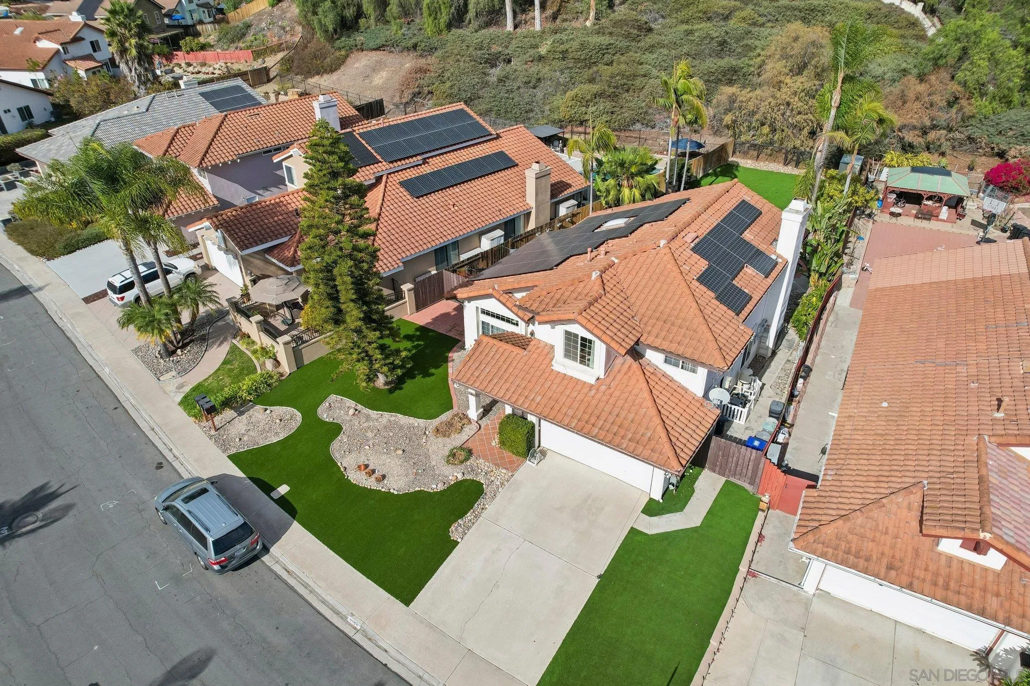 9186 Truman Street San Diego, CA 92129 - Photo 44 of 61 an aerial view of a house with a garden and trees