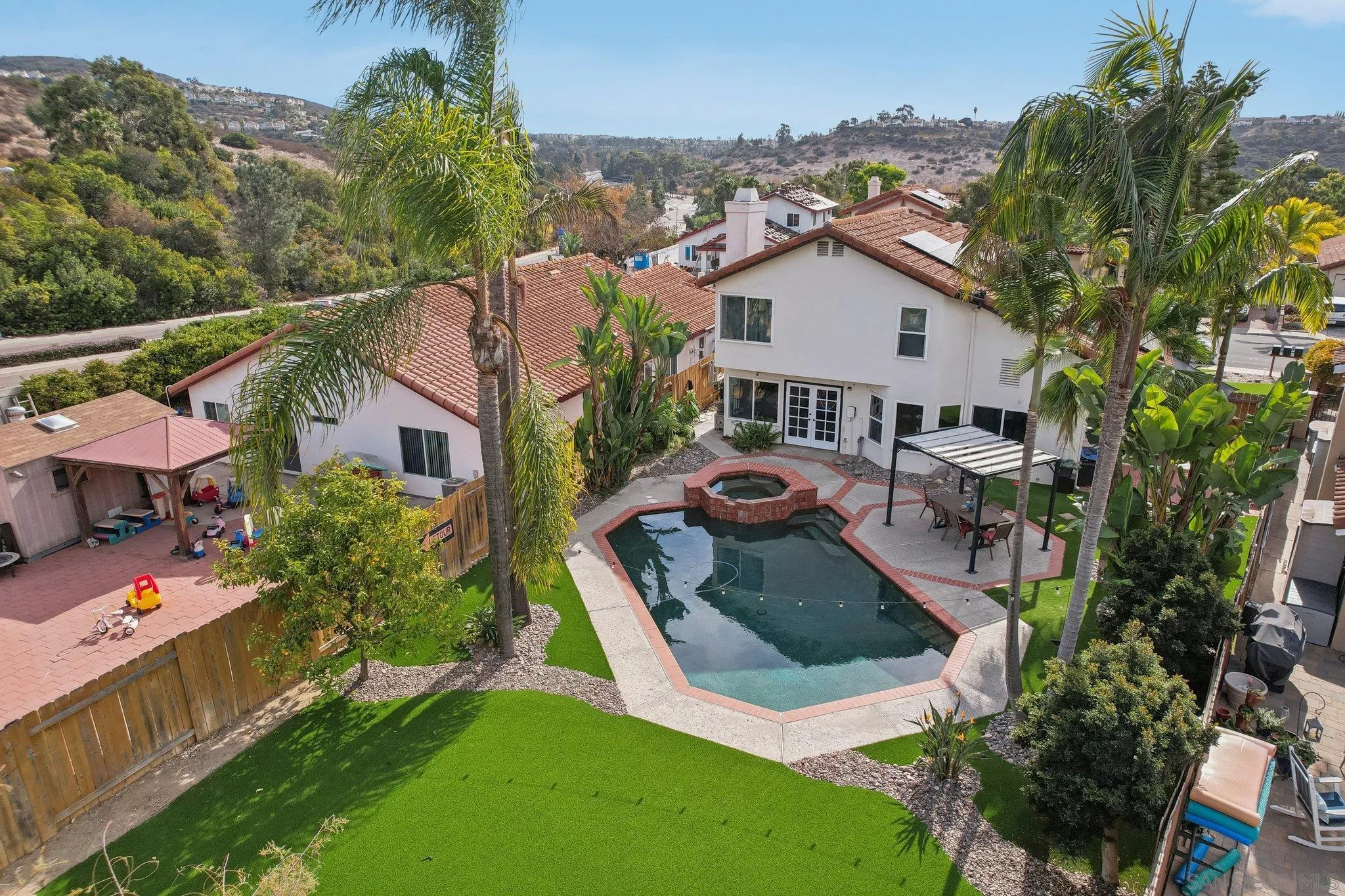9186 Truman Street San Diego, CA 92129 - Photo 55 of 61 an aerial view of a house with swimming pool garden and mountain view